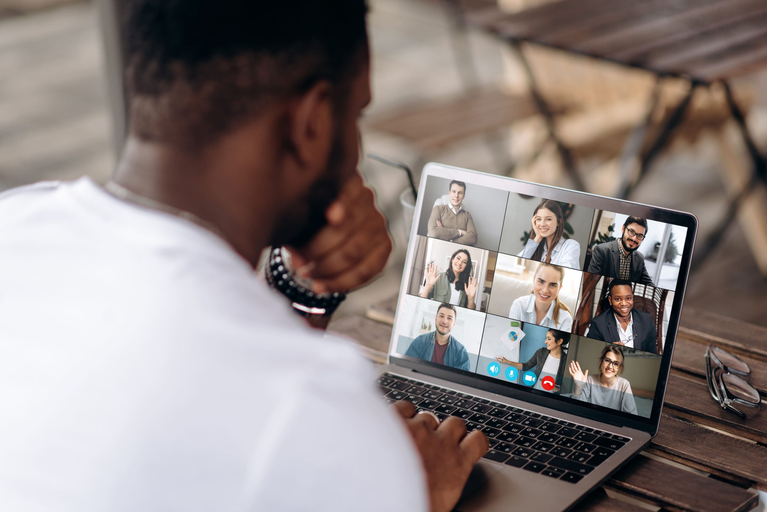 Man attending online meeting in his computer